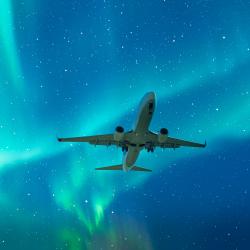Northern Lights with commercial passenger airplane